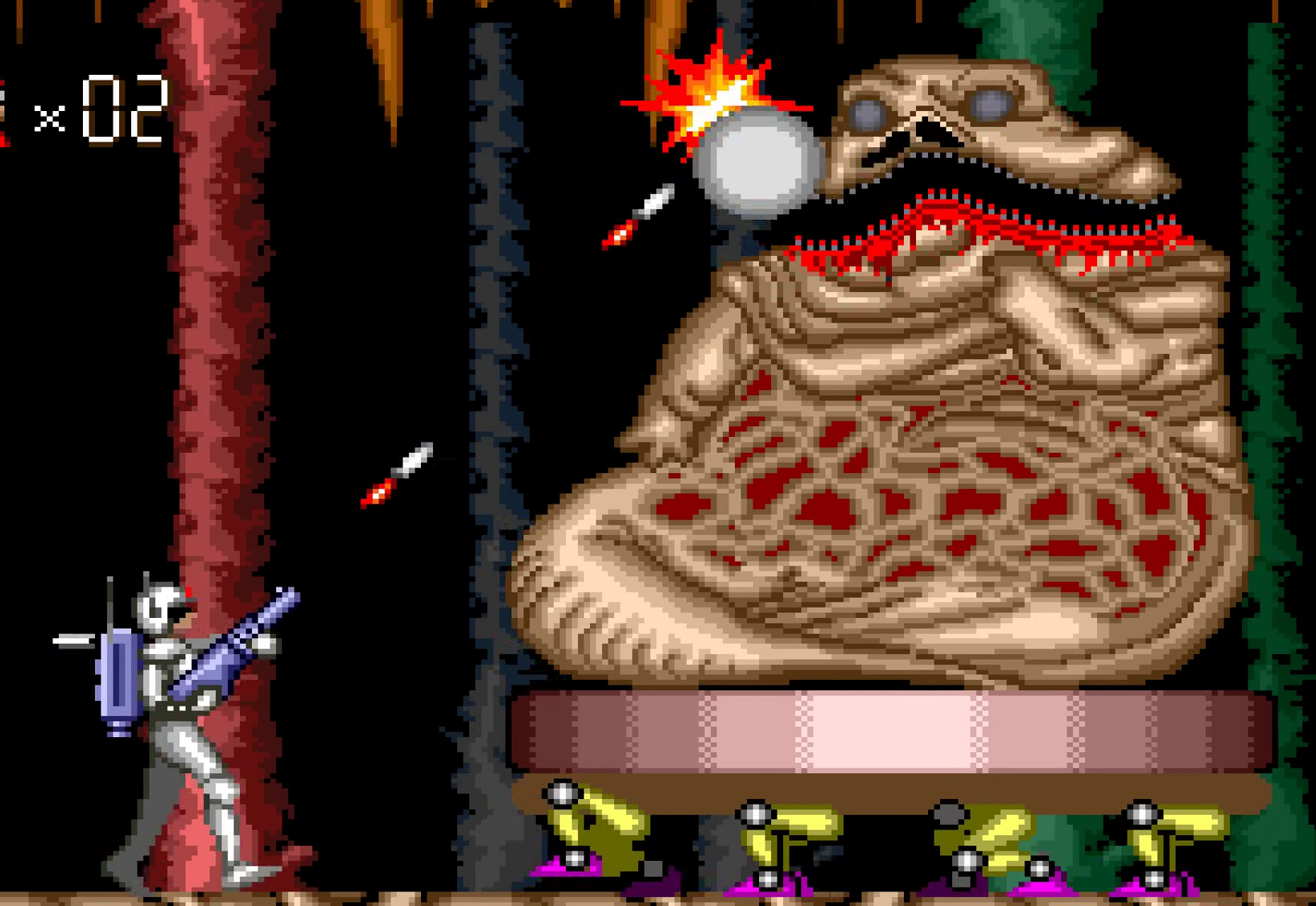 Boss fight against slug-like enemy resembling Jabba the Hutt