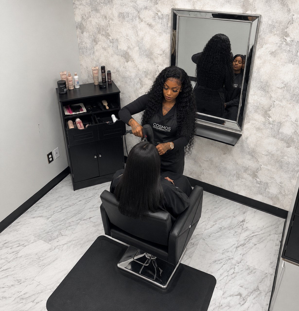 Beauty professional working with a client