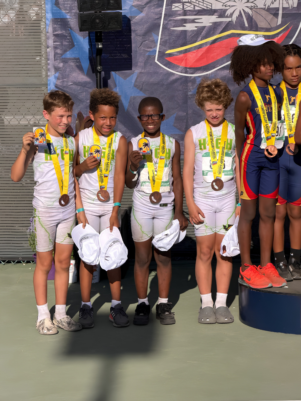 High Voltage athletes on podium
