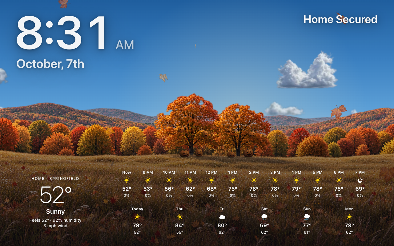 Halloween by day on the forecast screensaver: the lanterns and jack-o’-lanterns in the autumn trees