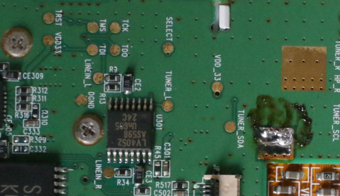 Picture of iRiver H10's PCB showing labeled and unsoldered JTAG pads