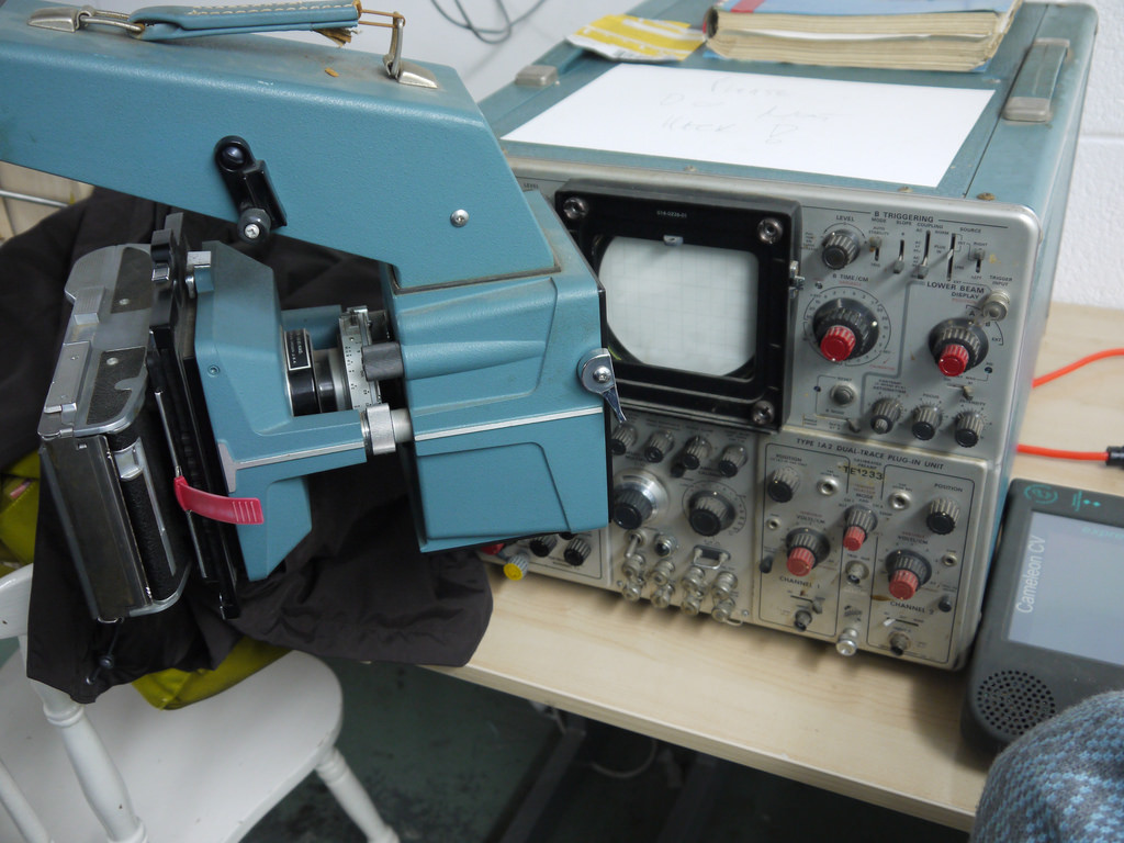 Image of a large Polaroid camera connected to an oscilloscope