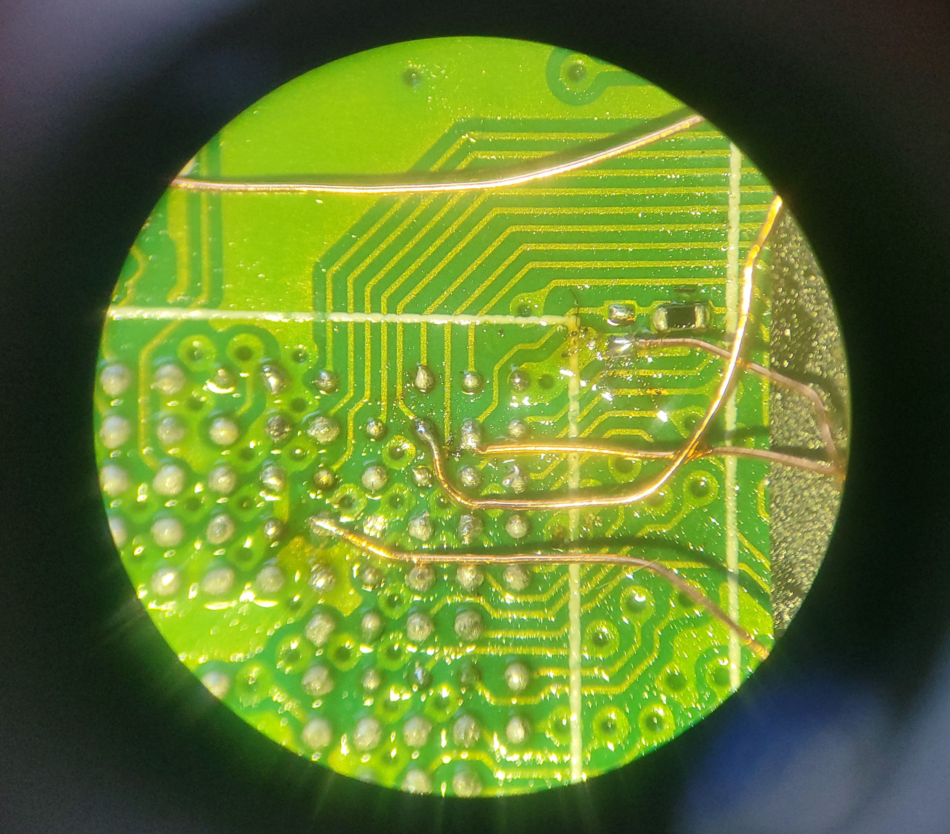 Microscope view of the wires soldered to the SoC pads