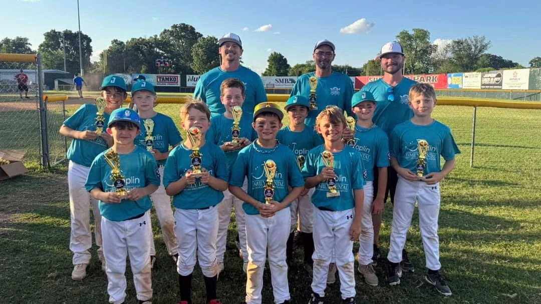 2024 Little League championship team with medals after 29-game winning streak using player development strategy