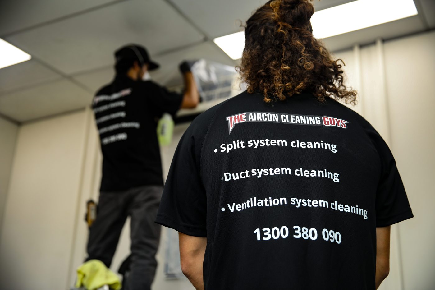 The Guys Group team servicing ducted air conditioning system at commercial property Sydney