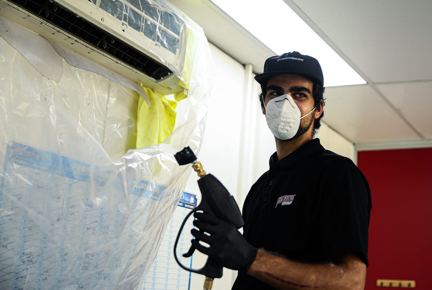 Technician sanitising ducted system with hospital grade treatment Sydney