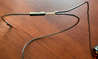 The negative wire from the battery connected to two female jumper leads