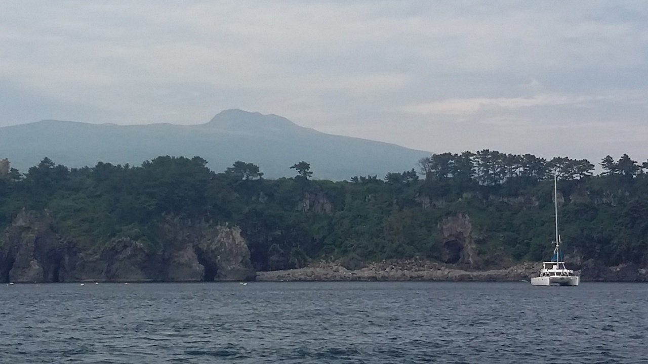 Jeju sailing yacht and coastline