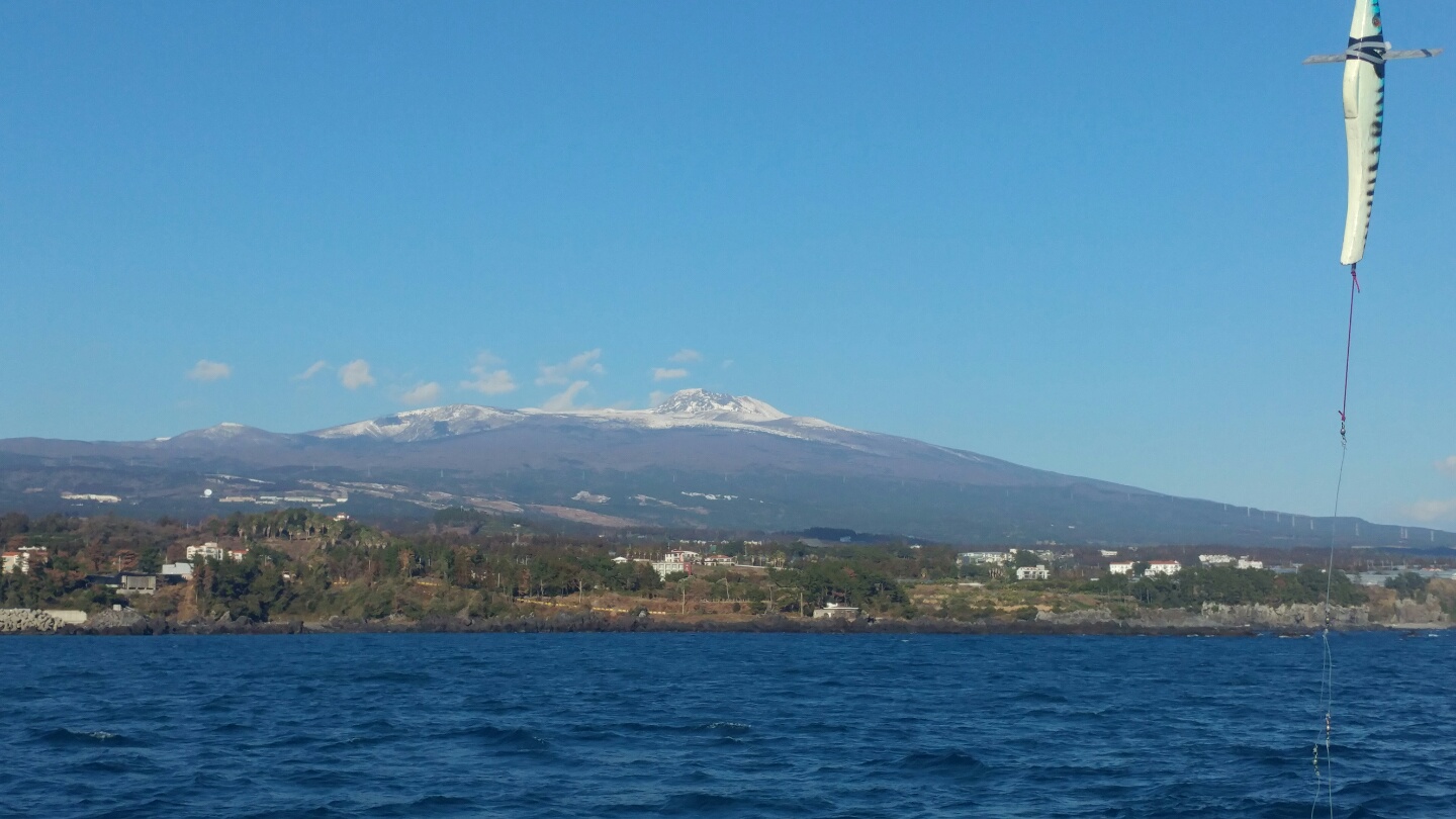 Jeju sailing yacht and coastline