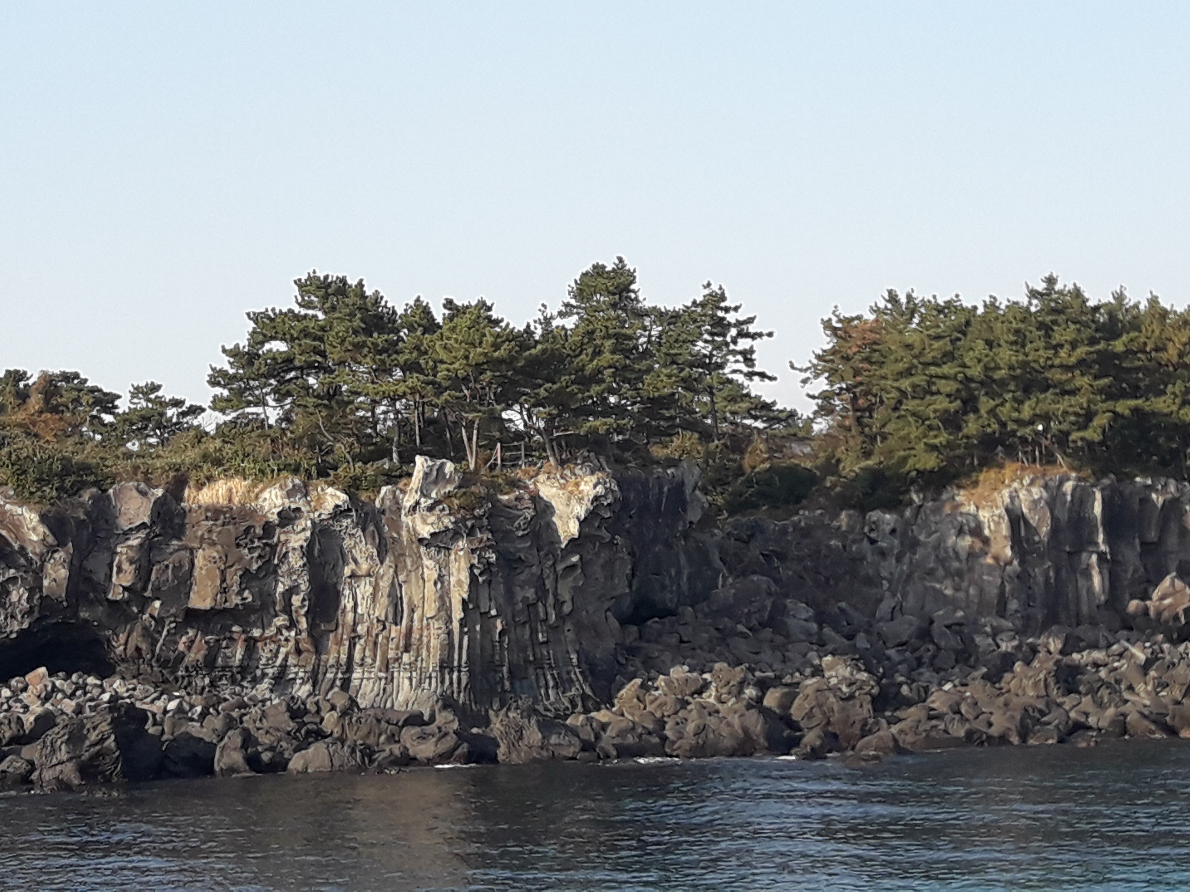 Jeju sailing yacht and coastline