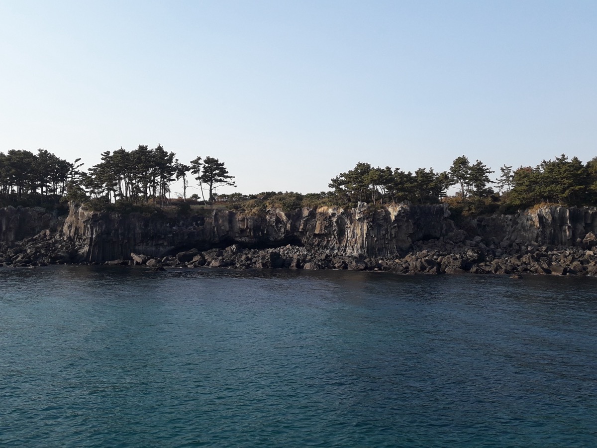 Jeju sailing yacht and coastline
