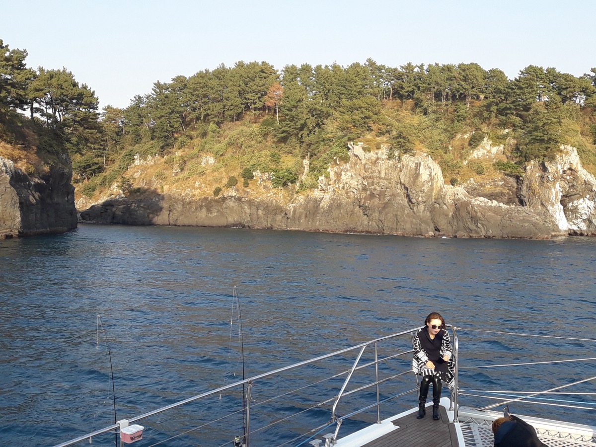 Jeju sailing yacht and coastline