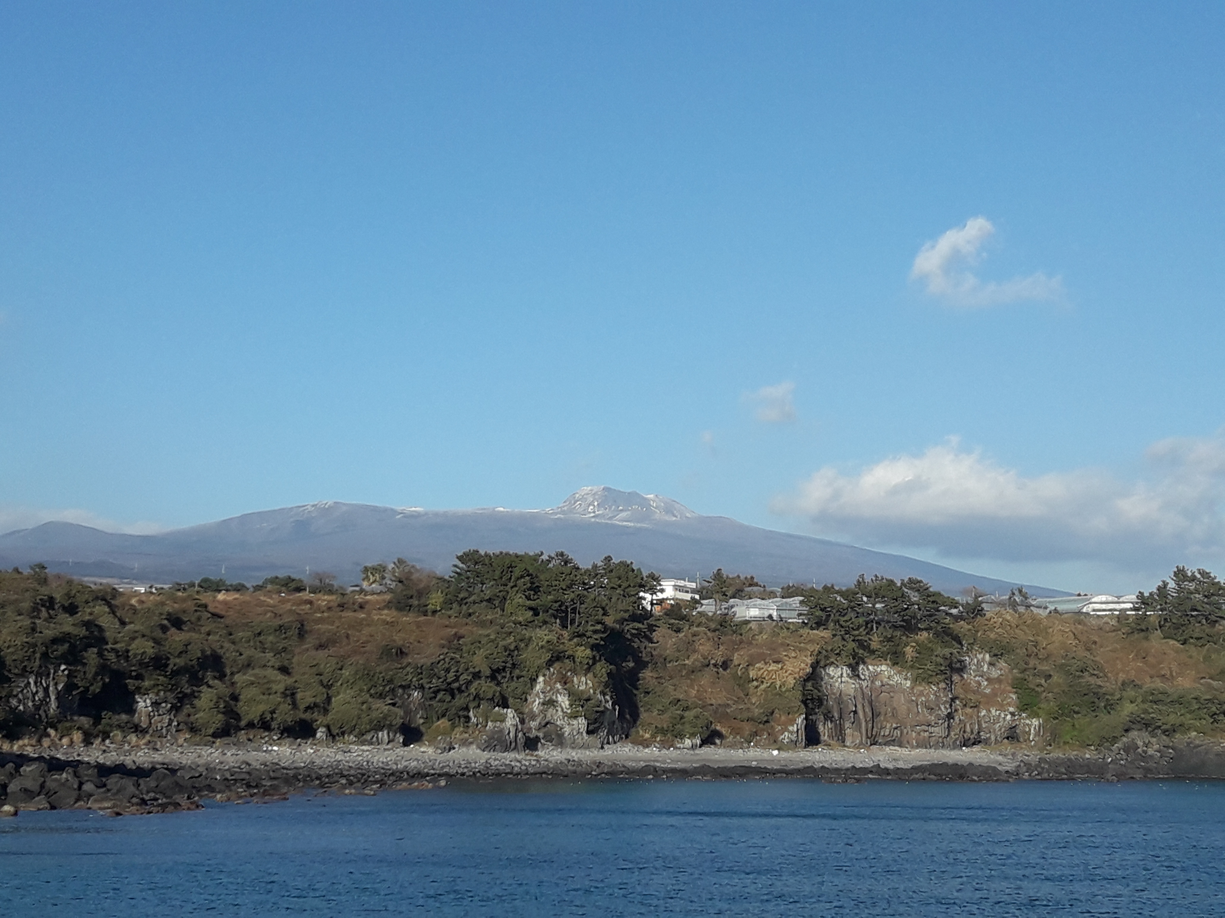 Jeju sailing yacht and coastline