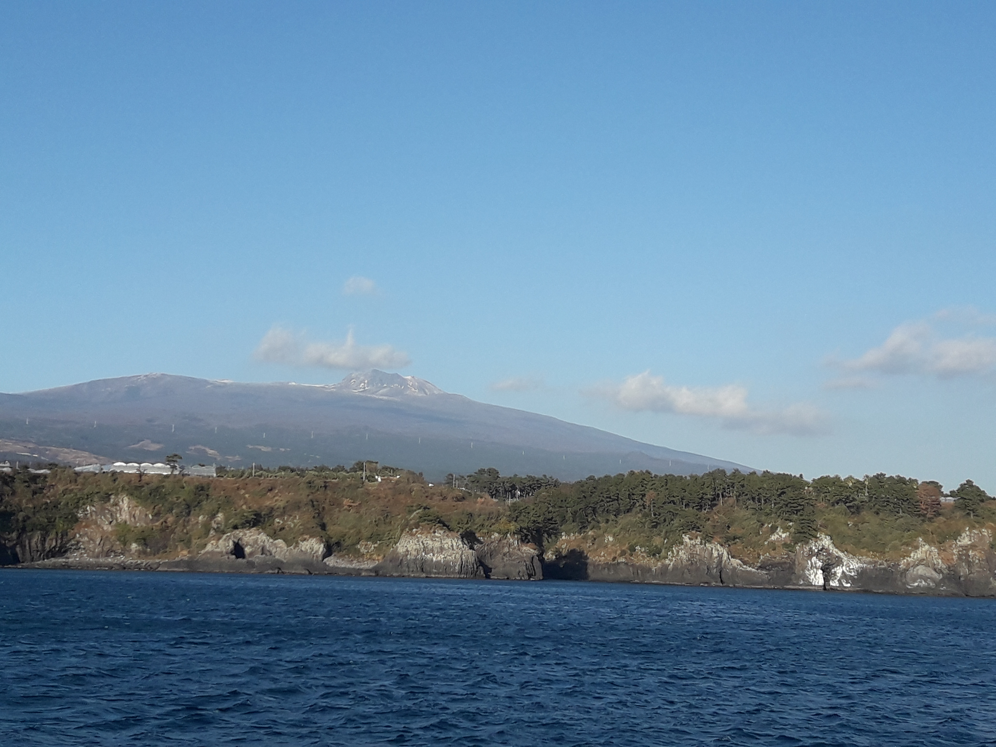 Jeju sailing yacht and coastline