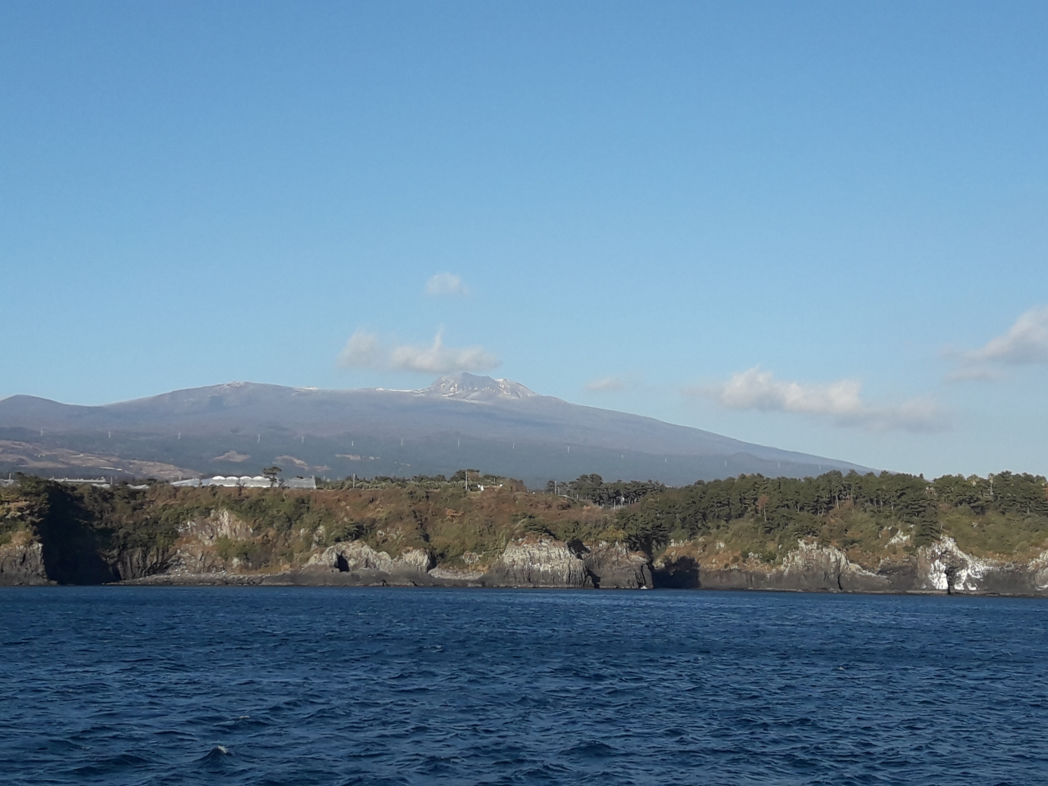 Jeju sailing yacht and coastline