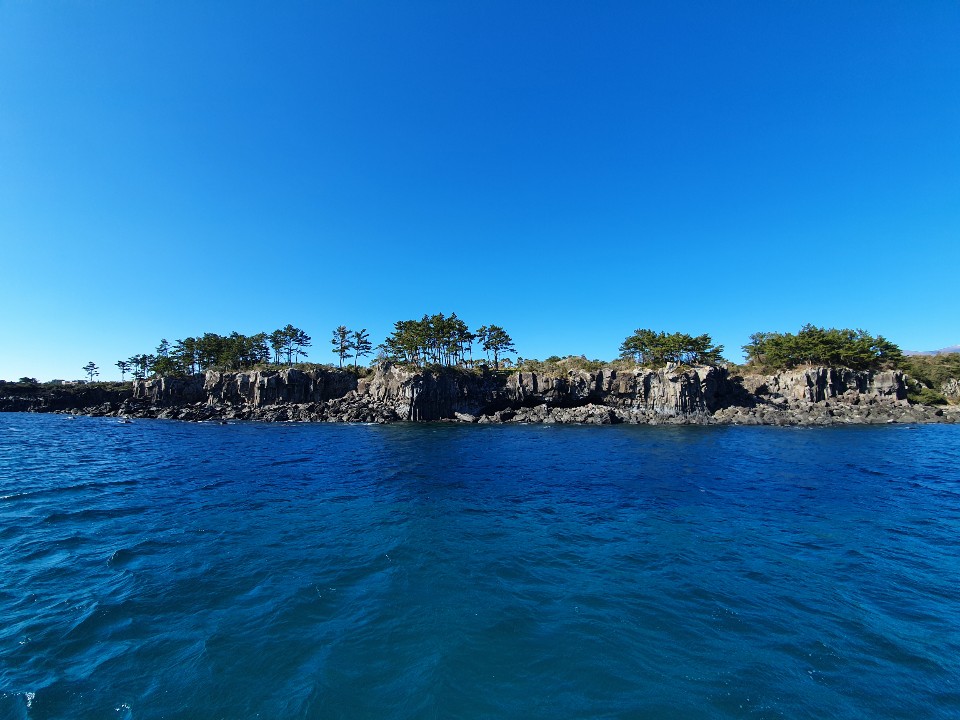 Jeju sailing yacht and coastline