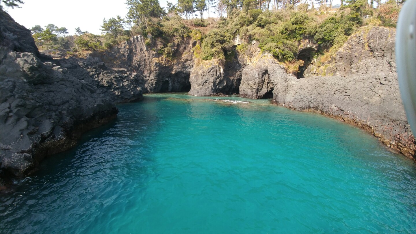 Jeju sailing yacht and coastline