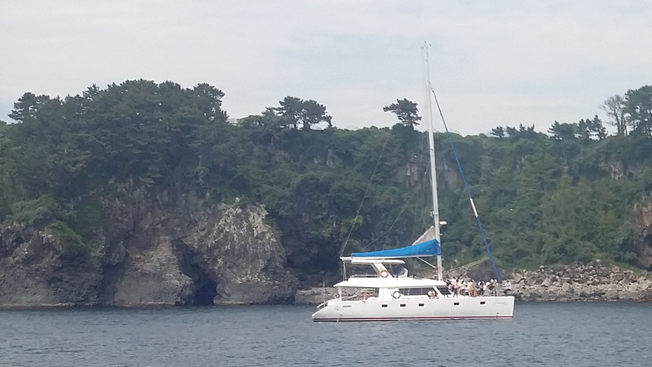 Jeju sailing yacht and coastline