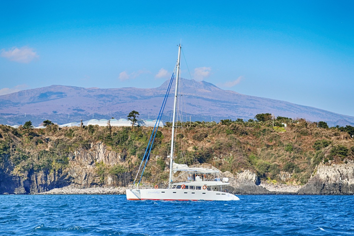 Jeju sailing yacht and coastline