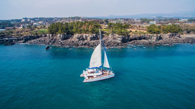 Jeju sailing yacht and coastline