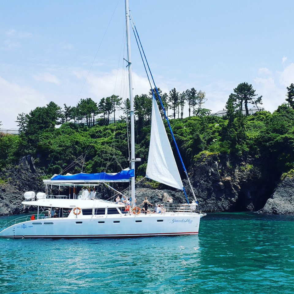 Jeju sailing yacht and coastline