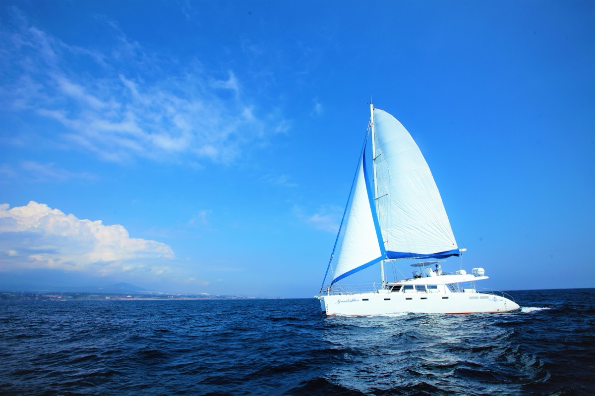 Jeju sailing yacht and coastline