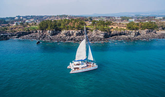 Jeju sailing yacht and coastline
