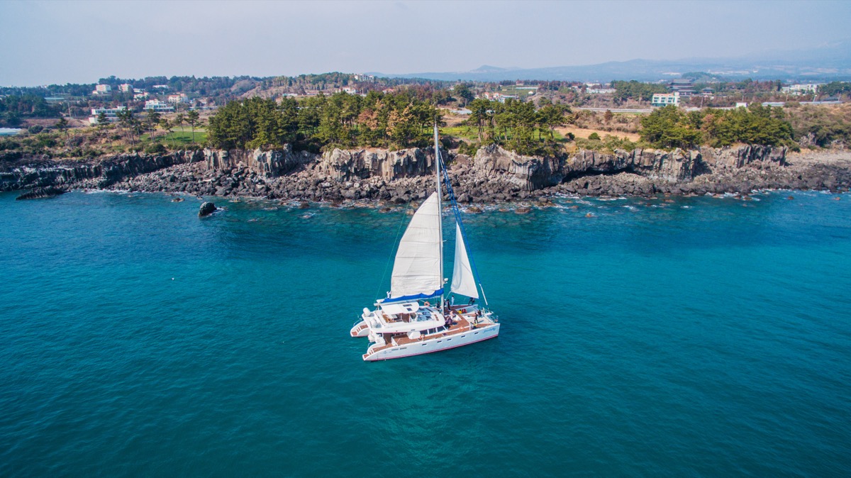 Jeju sailing yacht and coastline