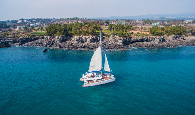 Jeju sailing yacht and coastline
