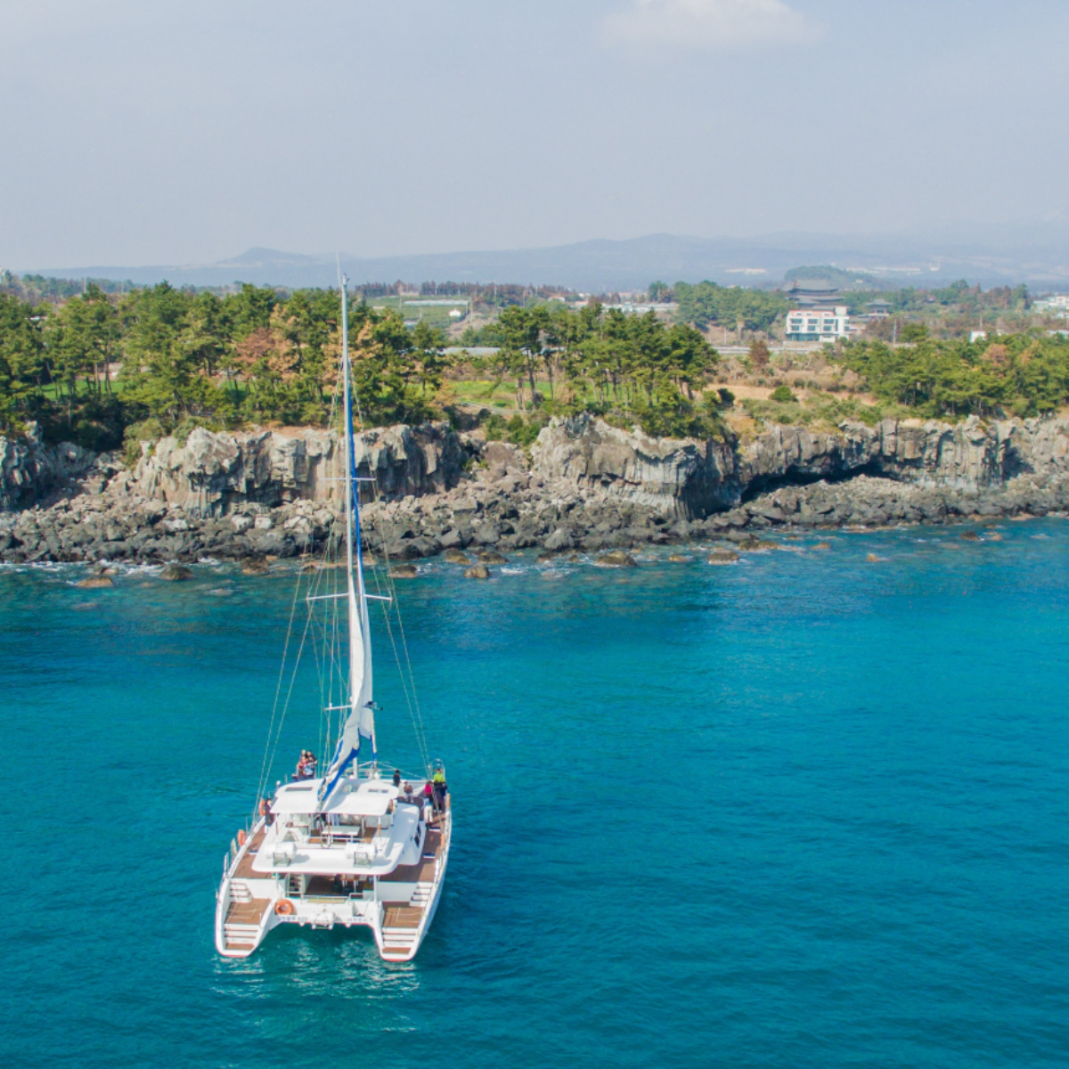 Jeju sailing yacht and coastline