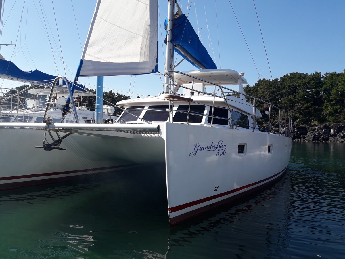 Jeju sailing yacht and coastline