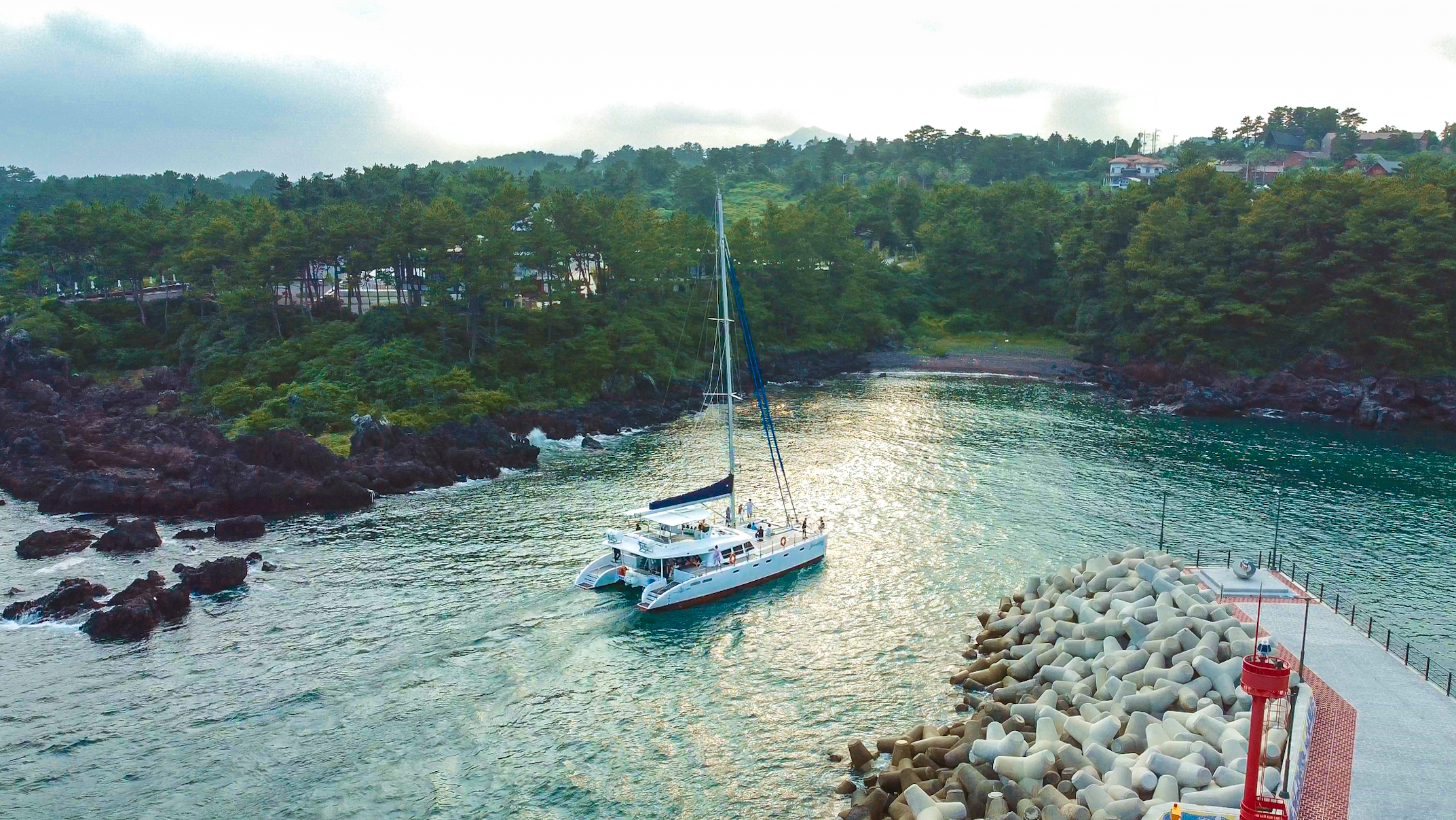 Jeju sailing yacht and coastline