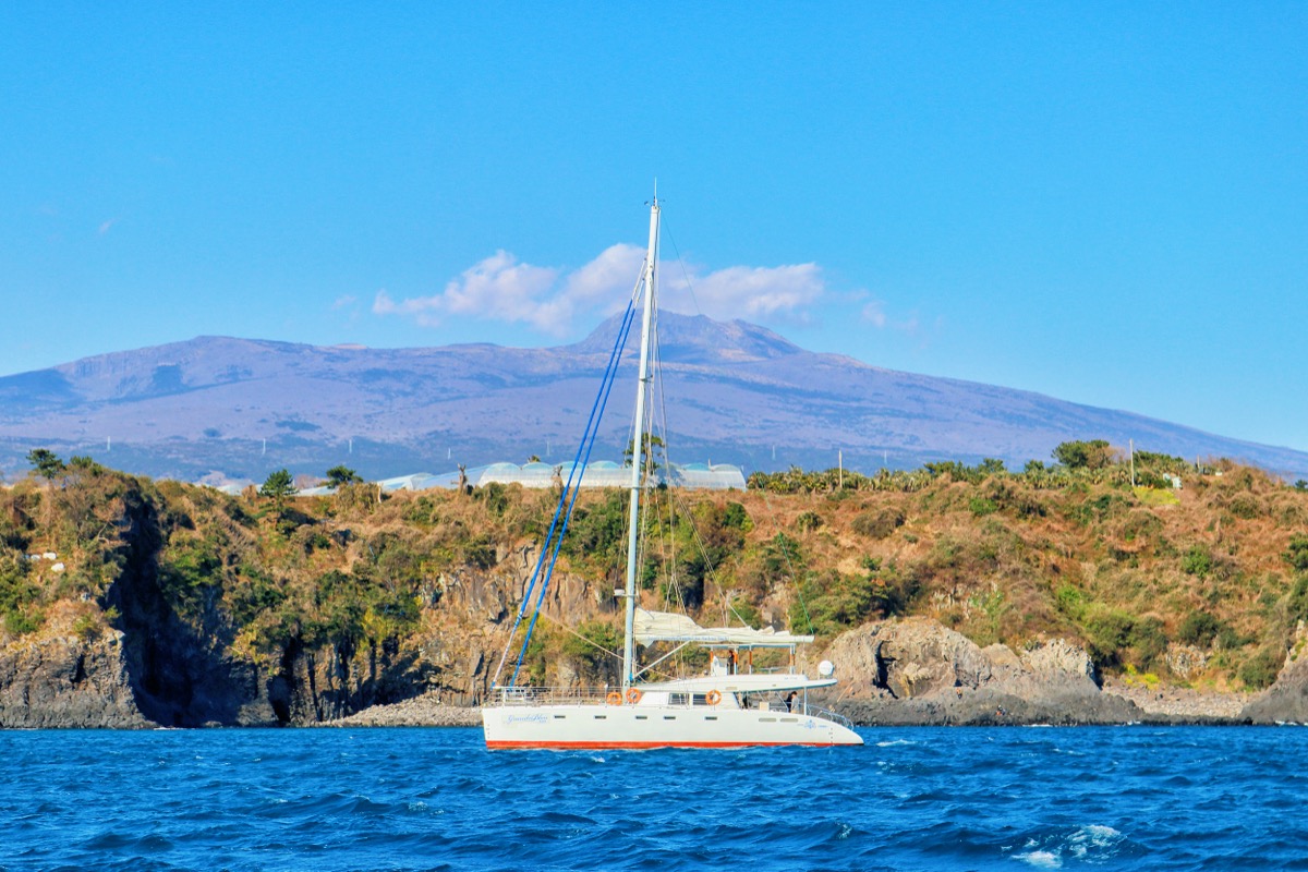Jeju sailing yacht and coastline