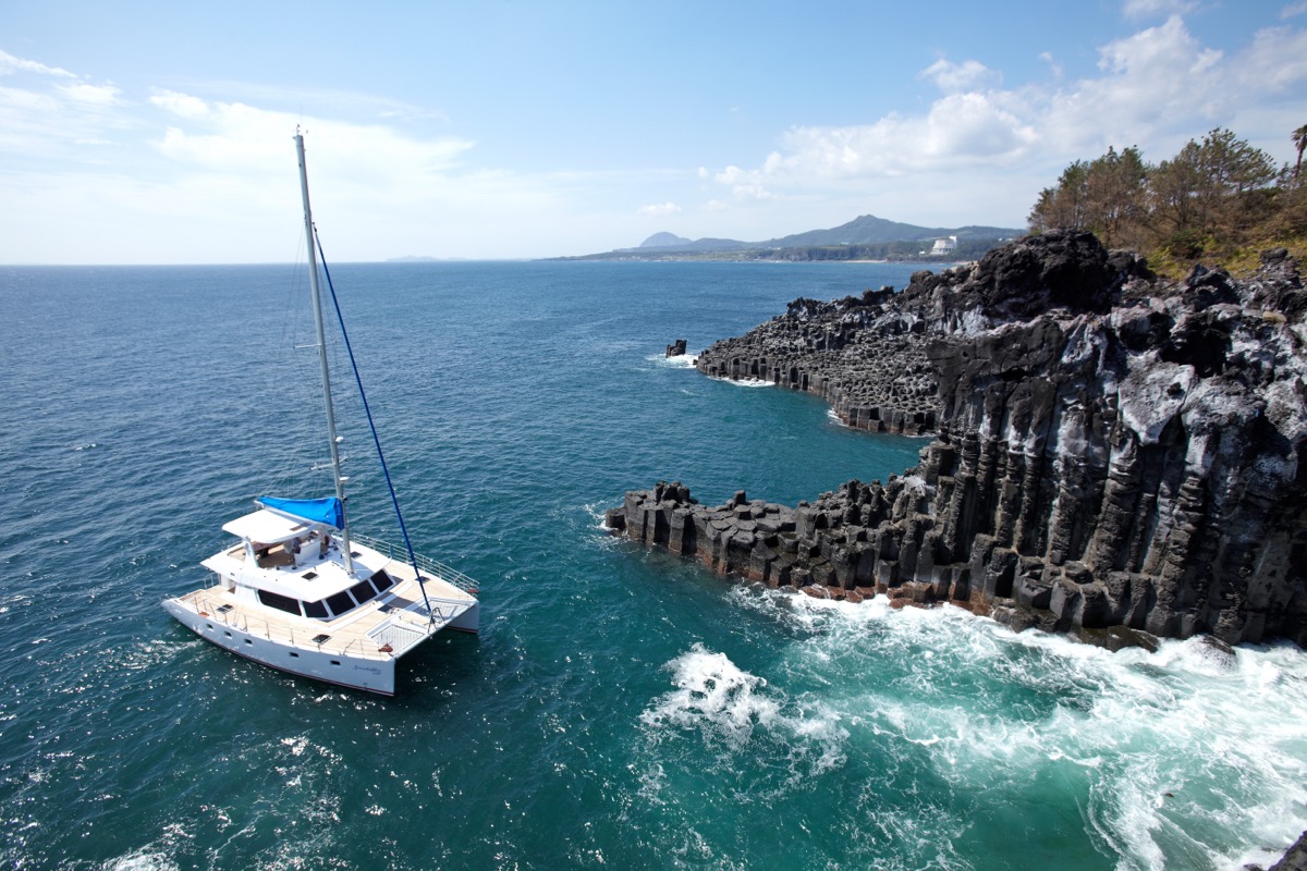 Jeju sailing yacht and coastline