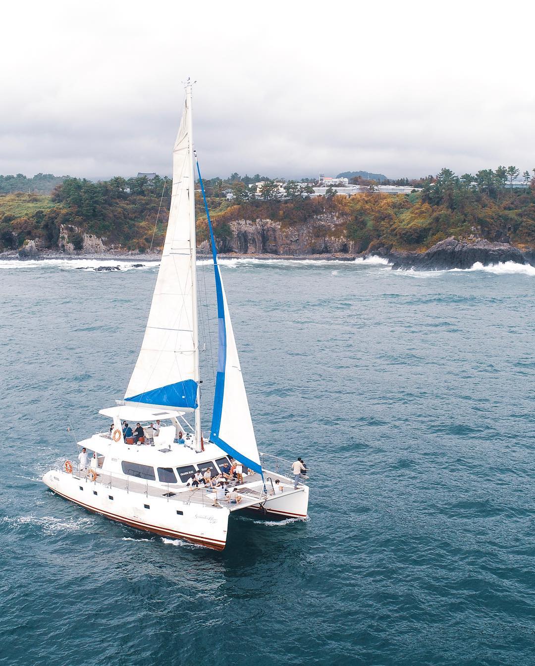 Jeju sailing yacht and coastline