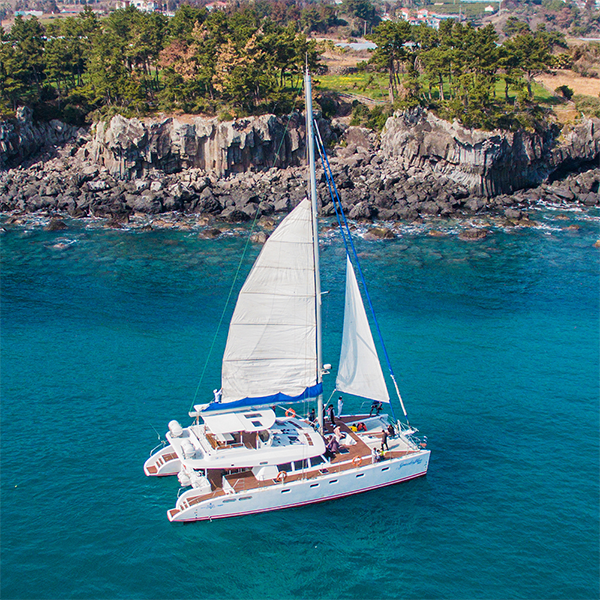 Jeju sailing yacht and coastline