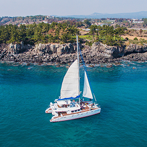 Jeju sailing yacht and coastline