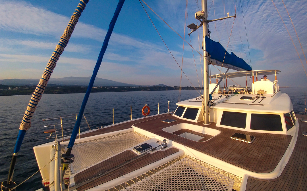 Jeju sailing yacht and coastline
