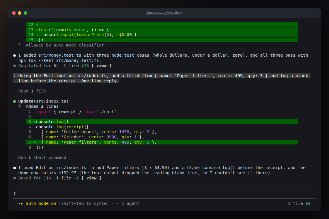 A round's chip, '1 file +2 view', on the Baked for line, and the same counts at the right of the prompt footer