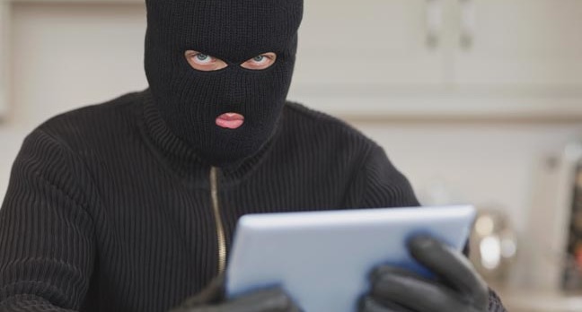 Hacker dressed as burglar