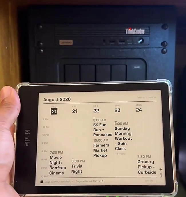 Holding the Kindle wall display
