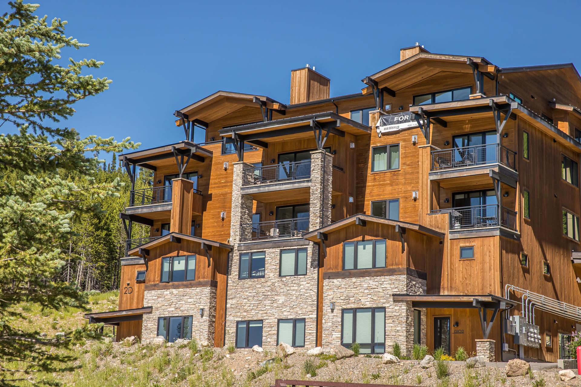 2D Summit View Drive 502D, Big Sky, Montana - the penthouse at Mountain Lake, a timber and stone condominium building facing Lone Mountain