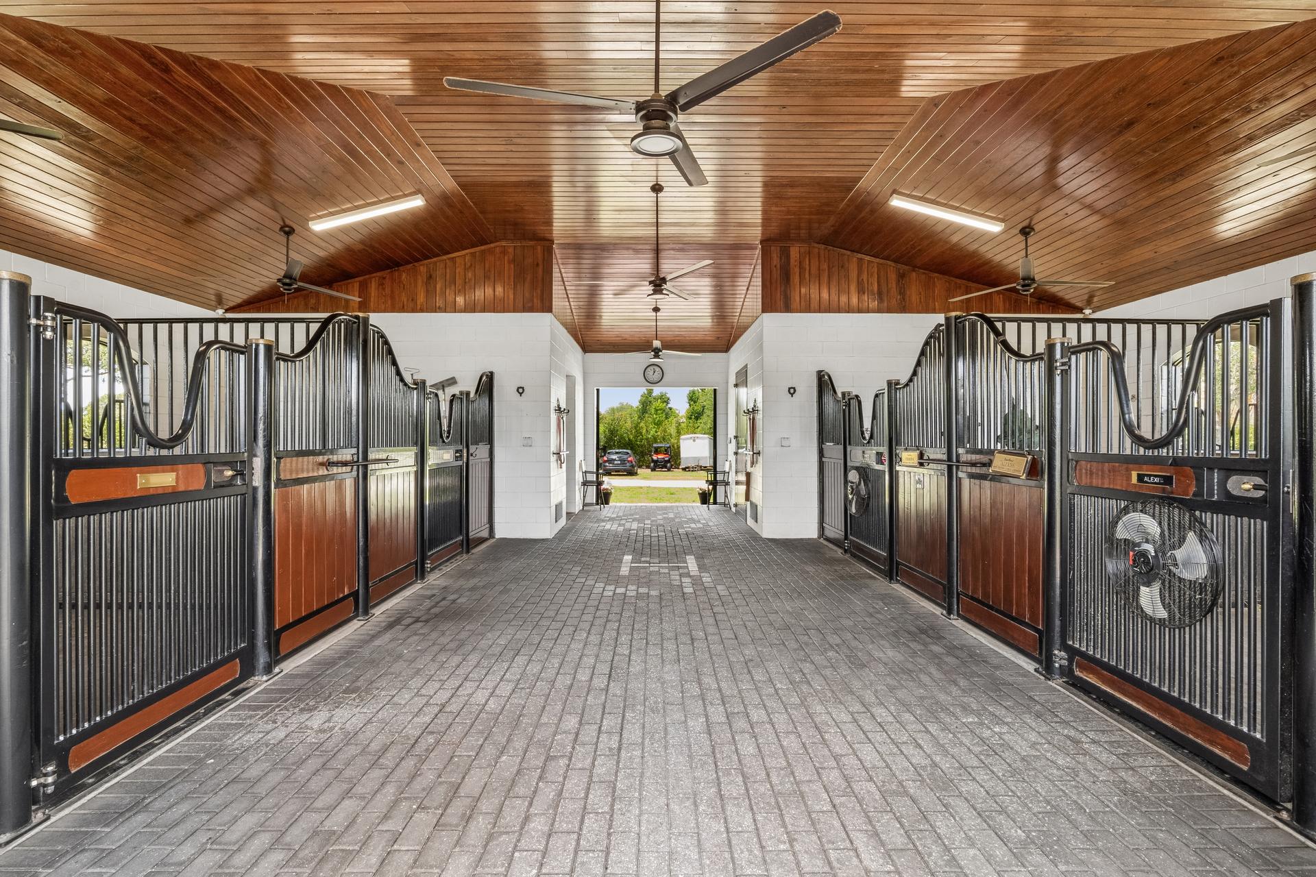 The residence at 746/0 Lake Mills Road, Oviedo, Florida — stone and stucco elevation opening onto the lawn