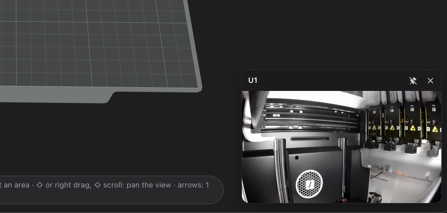 The printer's camera, pinned in a corner, with its ✕
