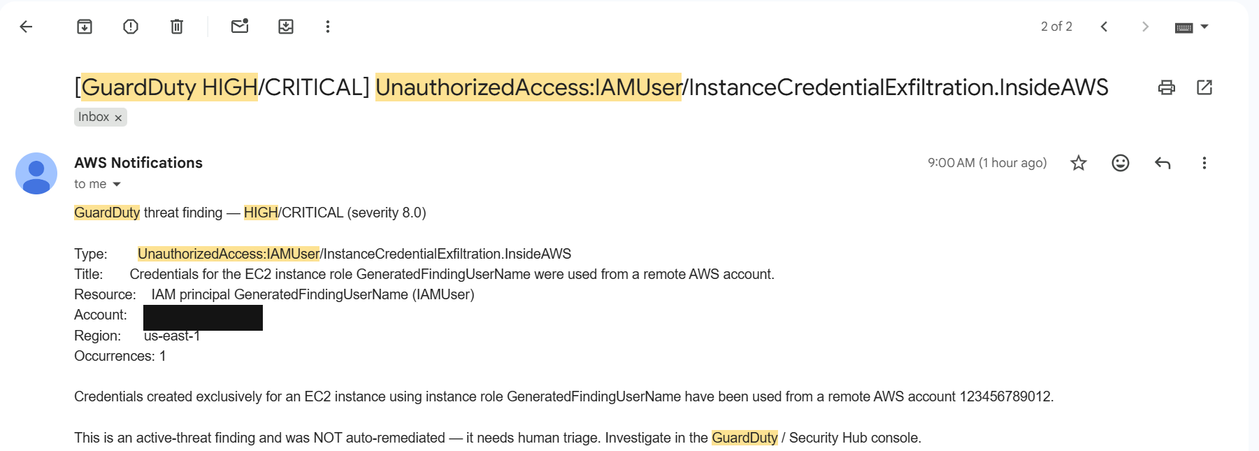 SNS email with subject GuardDuty HIGH describing a credential-exfiltration finding and stating it was not auto-remediated