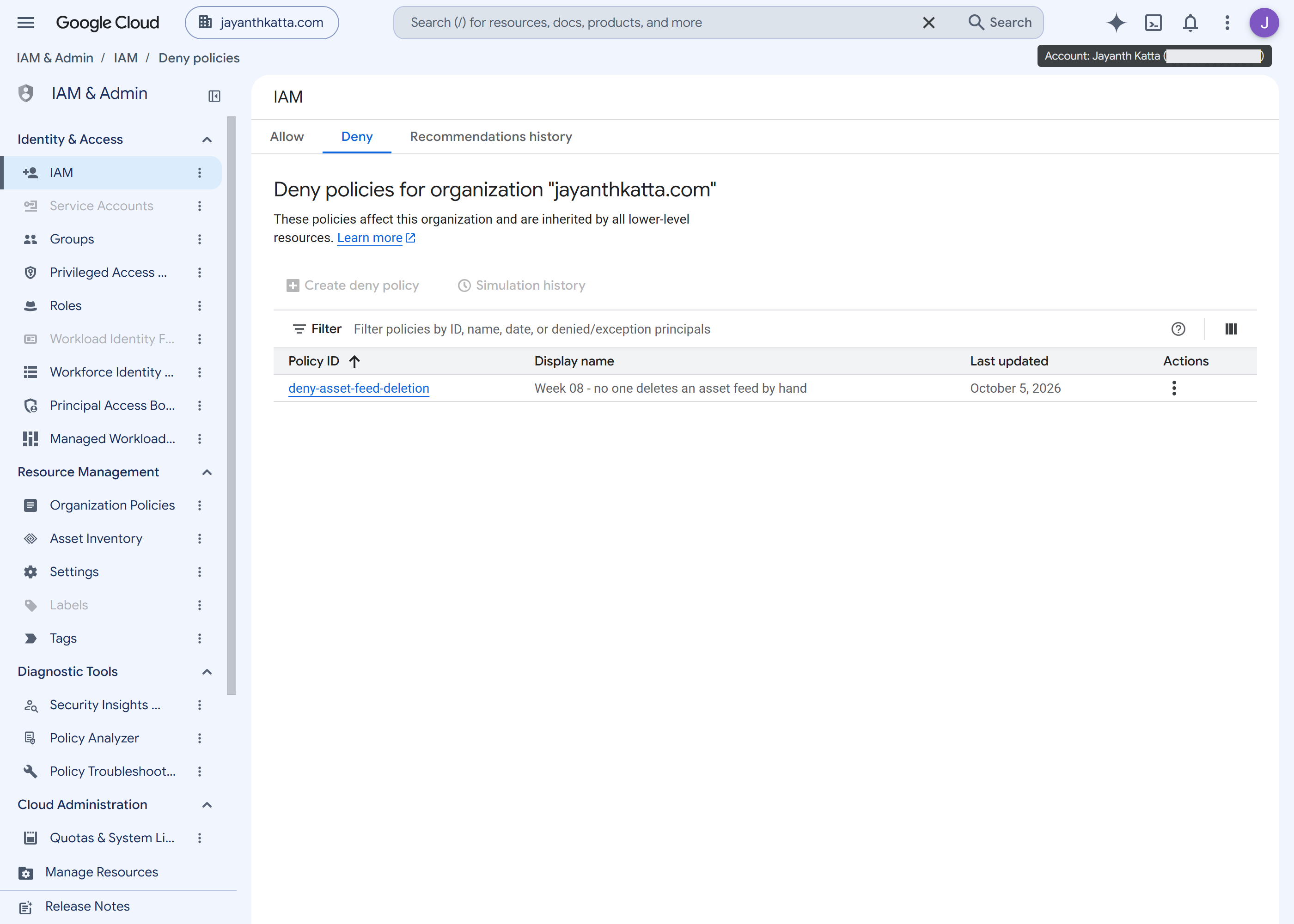 The Deny tab of the IAM page showing the deny-asset-feed-deletion policy at the organization