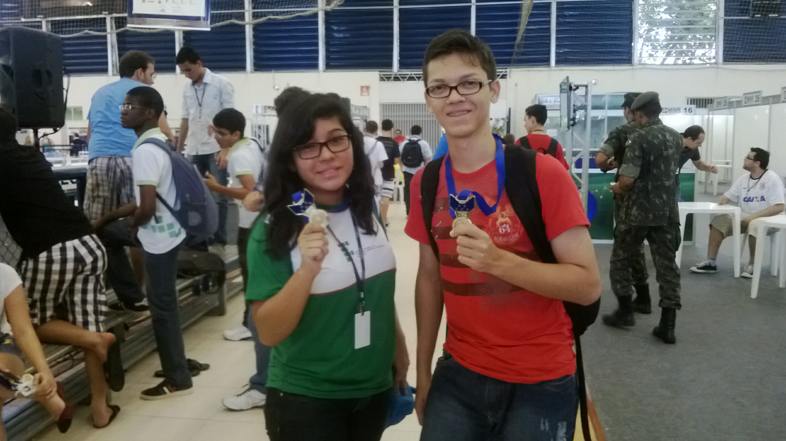 Gabi and Kelwyn holding their medals