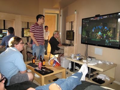 Photo showing another room with similar game stations along the walls.
