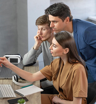 IT professionals collaborating at KGE Technologies