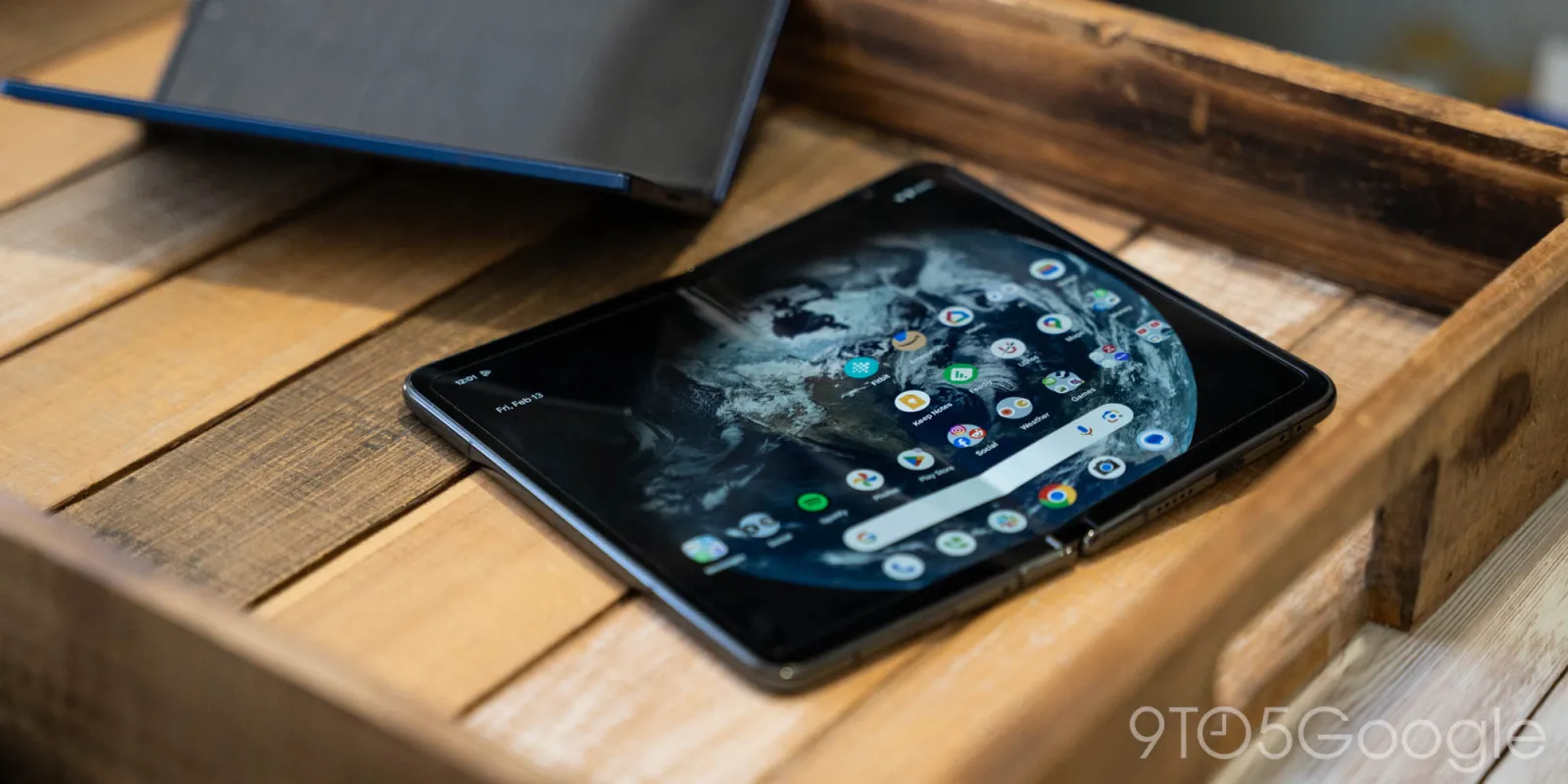 A book-style foldable phone showing its large inner screen